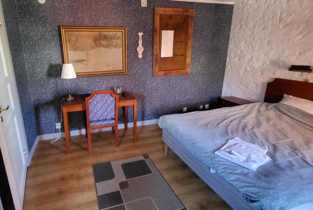 Postel nebo postele na pokoji v ubytování Hotell Mikaelsgården