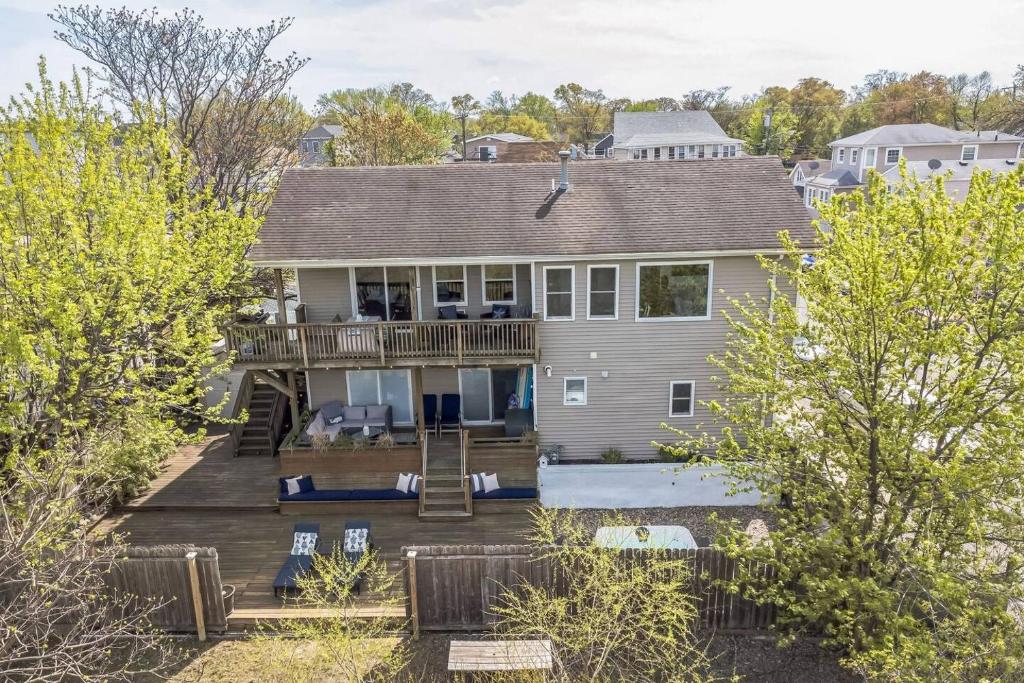 an aerial view of a house with a deck at Beach front oasis - Hot tub - Sleeps 7 in Keansburg
