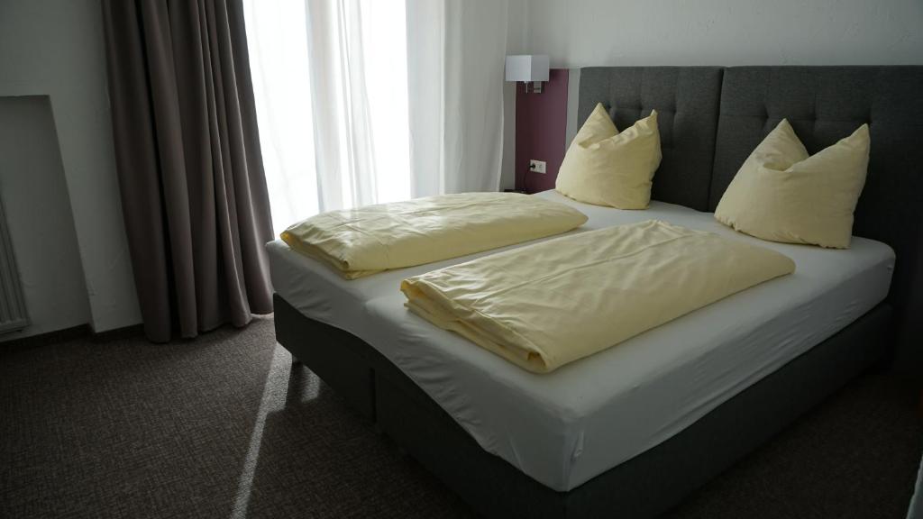 Postel nebo postele na pokoji v ubytování Hotel Sonnenbichl