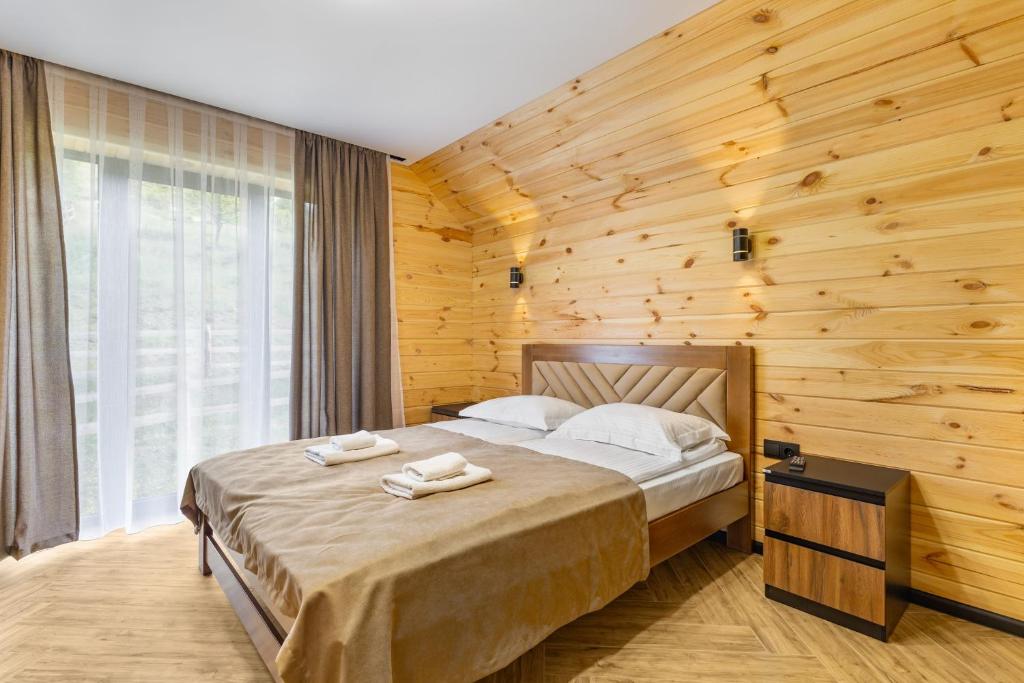 Postel nebo postele na pokoji v ubytování Smerichka