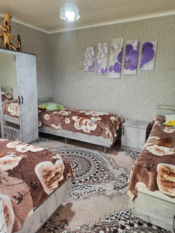Postel nebo postele na pokoji v ubytování Olga Guest House