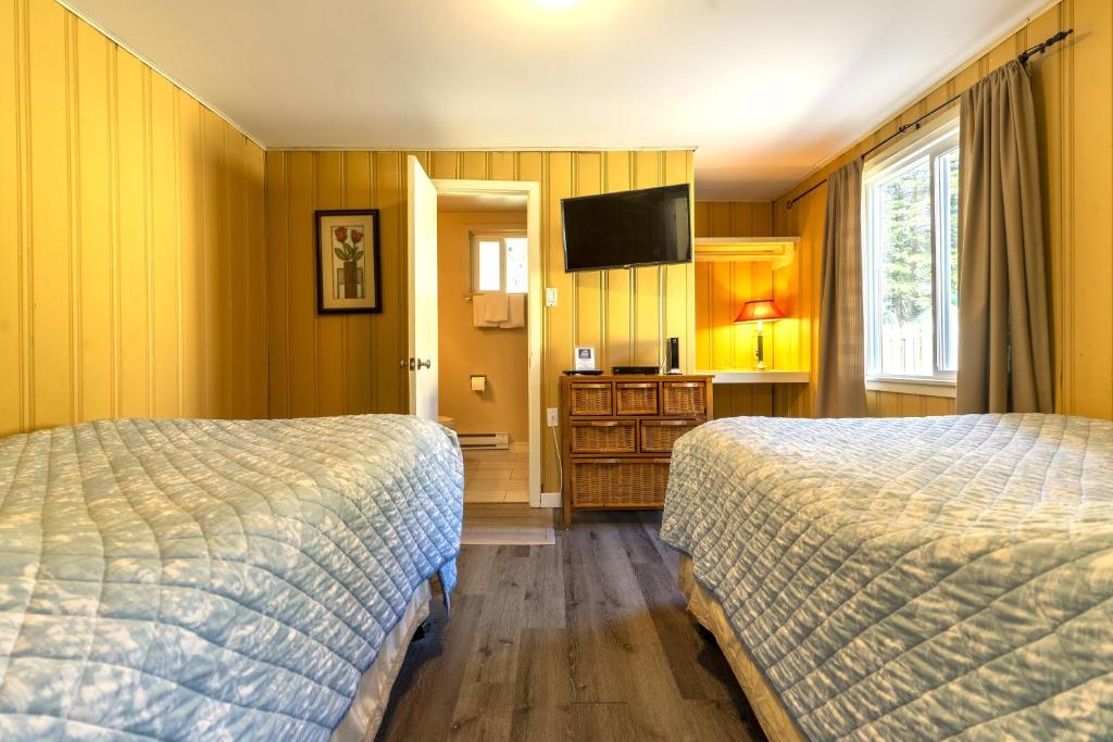 Postel nebo postele na pokoji v ubytování Richca Chalets Resort