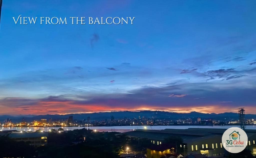 a view from the balcony of a city at sunset at 3G Cebu Condo Rental in Lo-oc