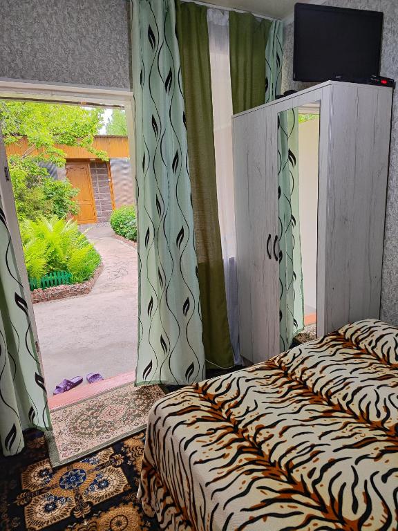 Postel nebo postele na pokoji v ubytování Olga Guest House