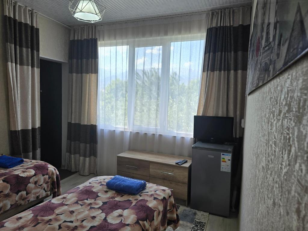 Postel nebo postele na pokoji v ubytování Olga Guest House