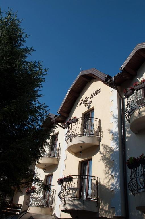 a building with balconies on the side of it at Villa Una in Bihać