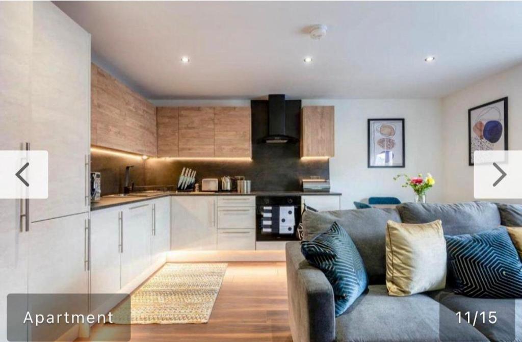 a living room with a couch and a kitchen at LUSH 2 Bed Central Apartment Hull Centre in Hull