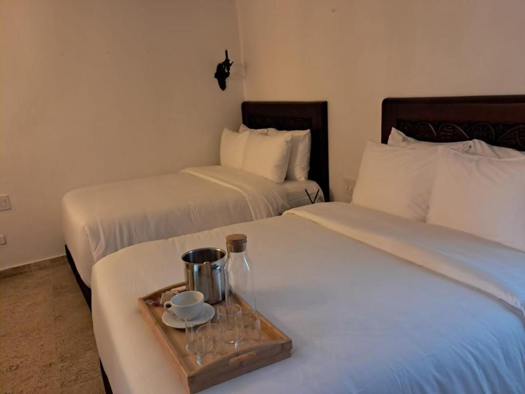 Postel nebo postele na pokoji v ubytování Hotel Boutique Patio Corao