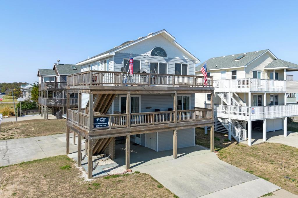 an aerial view of a house with two decks at Coasties Ocean Breeze in Kill Devil Hills