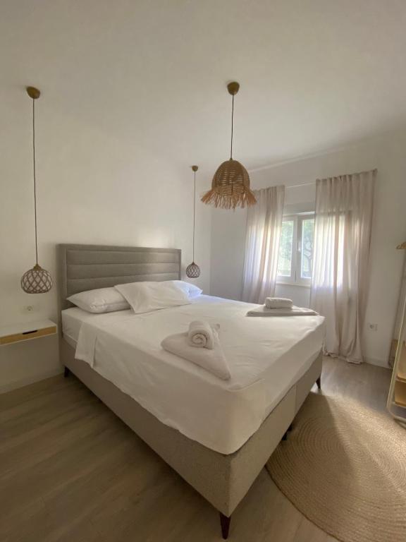 a bedroom with a bed with a towel on it at Boka Bliss in Zelenika