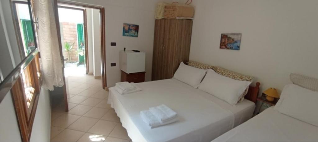 Postel nebo postele na pokoji v ubytování Tékada Hotel & Restaurant