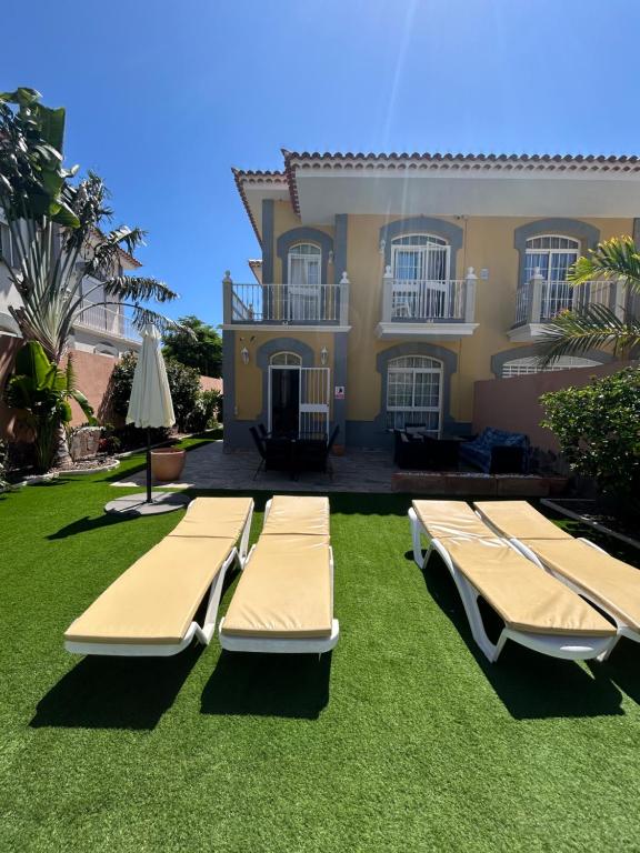 a house with two beds in front of it at Villa Lady#Luxury Costa Adeje in Adeje