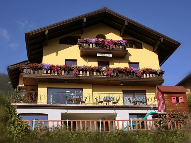 a building with a balcony with flowers on it at Haus Rattenböck in St. Wolfgang