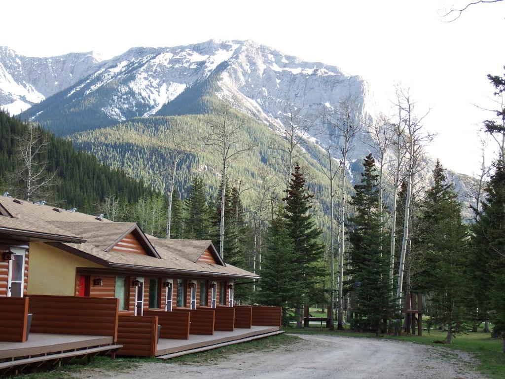 a mountain range with trees and mountains at Jasper Gates Resort in Jasper