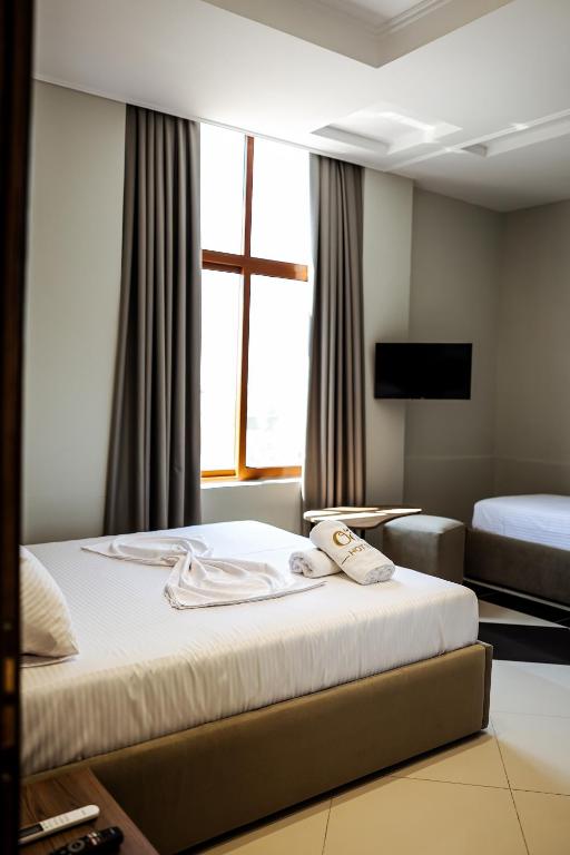 Postel nebo postele na pokoji v ubytování OLI Hotel