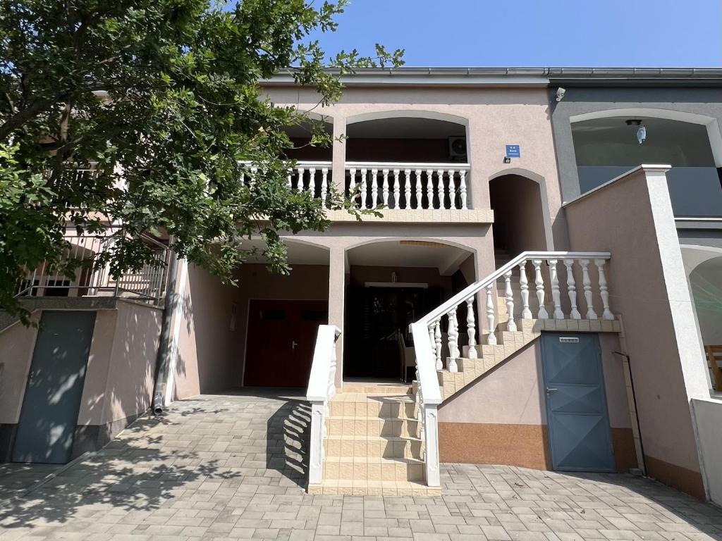 a house with a staircase and a stair case at Apartment Starigrad 11683b in Starigrad