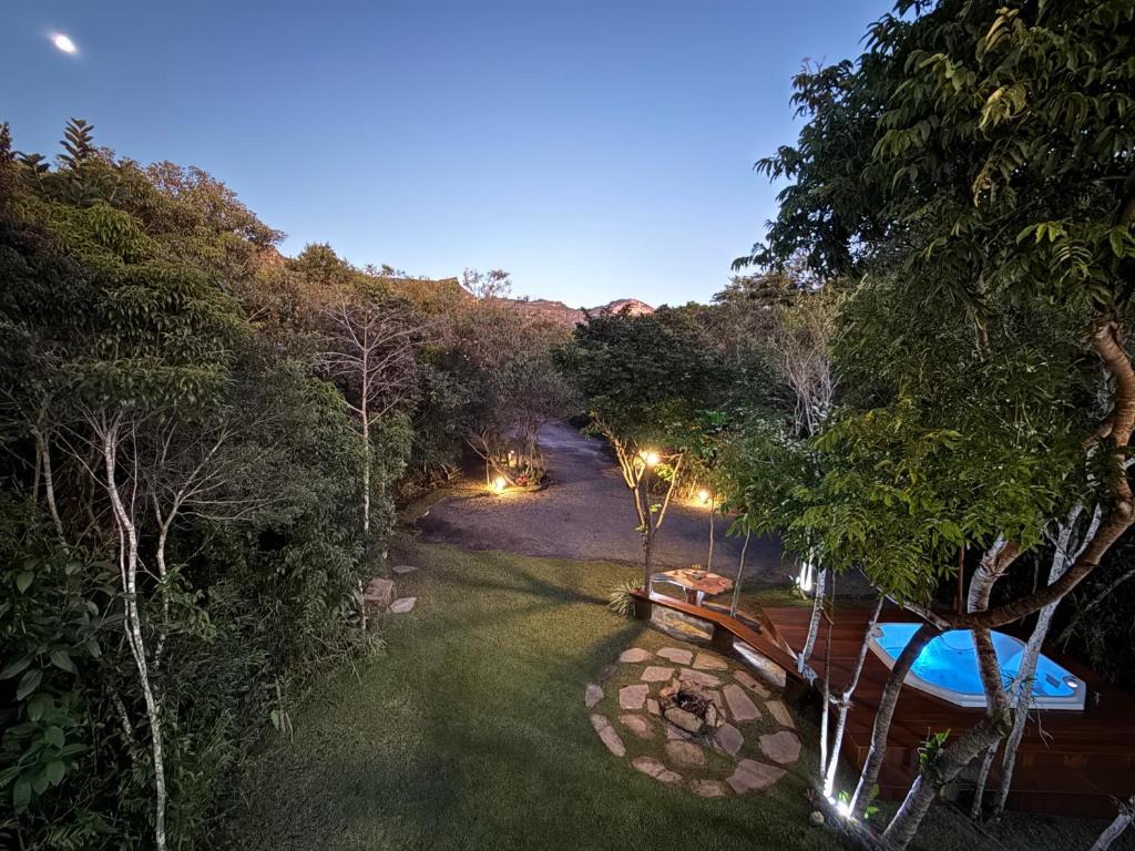 an overhead view of a backyard with a pool and lights at Casa.dovale3 in Caeté-Açu