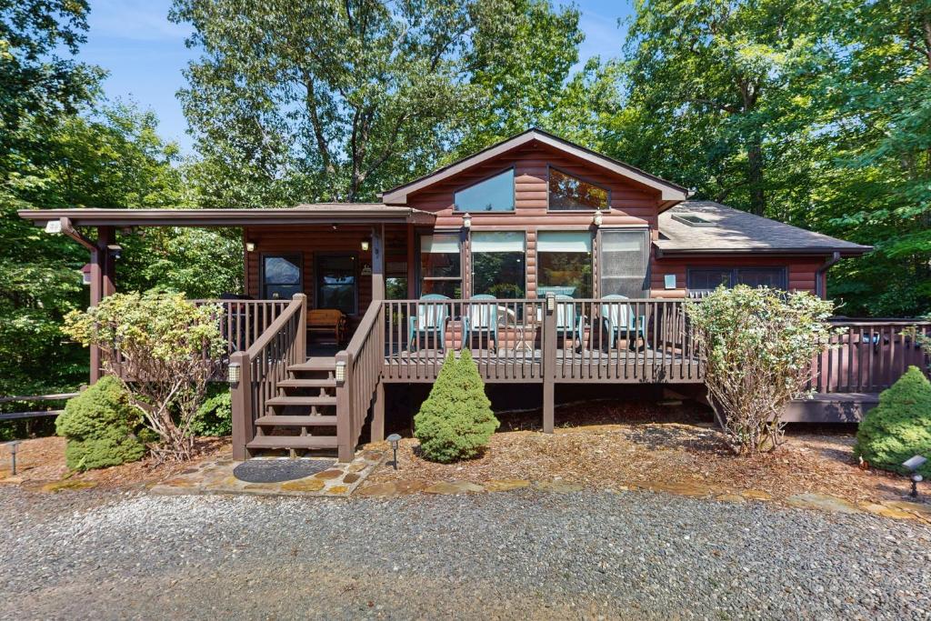 a small log cabin with a deck and porch at Time Out in Blue Ridge
