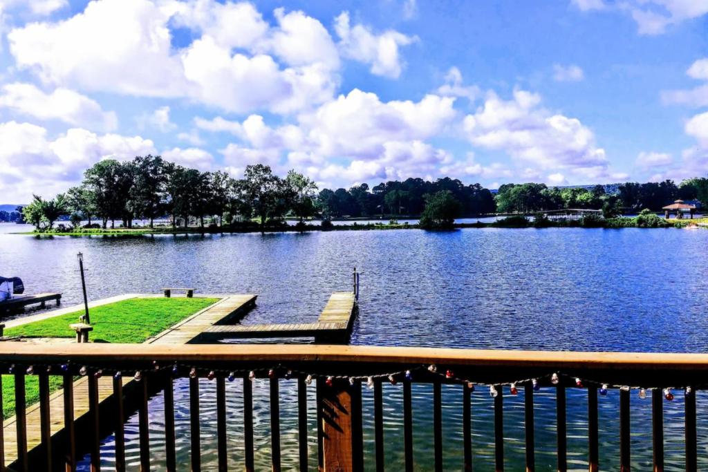 a view of a lake with a wooden dock at Central Terrace Retreat in Hot Springs