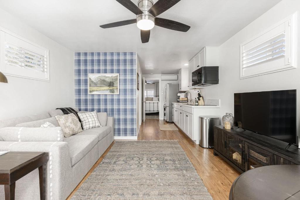 a living room with a couch and a flat screen tv at Mountain View Apartment in North Fork