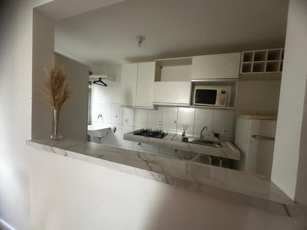 Η κουζίνα ή μικρή κουζίνα στο Apartamento por temporada 1, 2 ou 3 meses