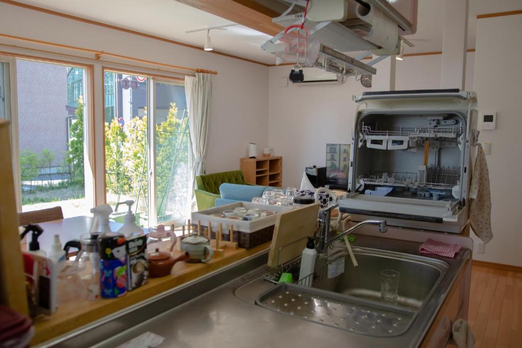 Kuchyň nebo kuchyňský kout v ubytování GuestHouse　YOU&I
