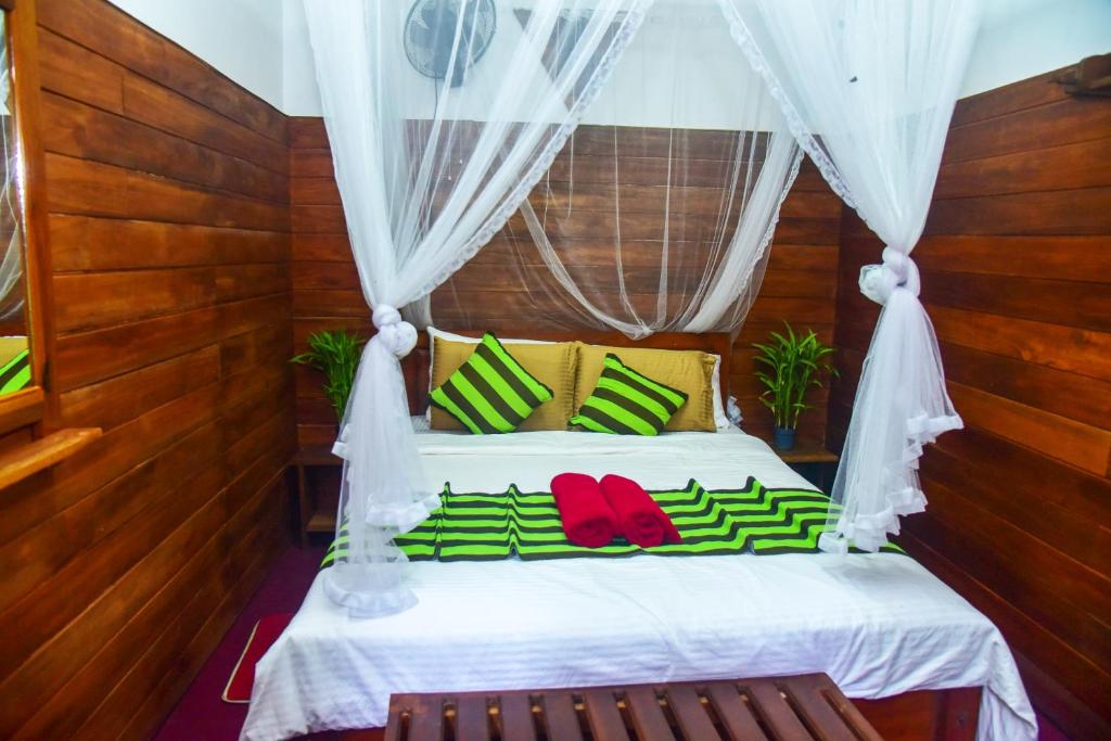 Postel nebo postele na pokoji v ubytování MUM Jungle Inn