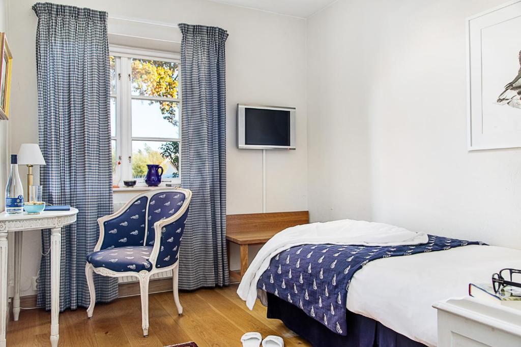 Postel nebo postele na pokoji v ubytování Hotell Gässlingen