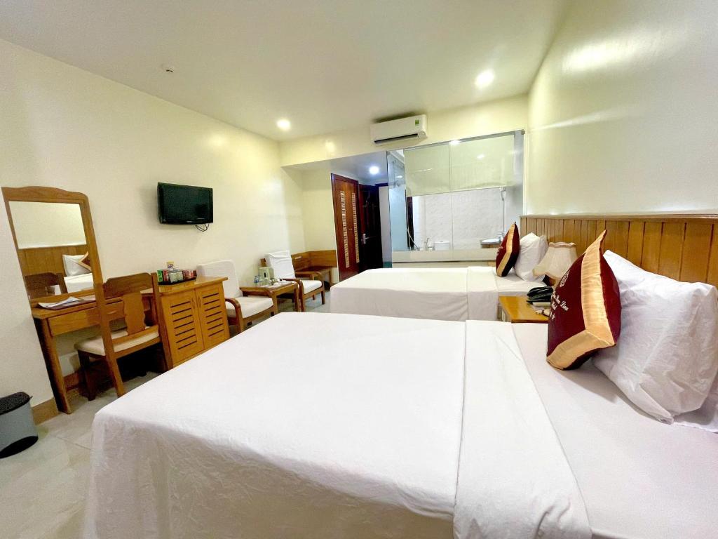Postel nebo postele na pokoji v ubytování SÀI GÒN - BẠC LIÊU Hotel