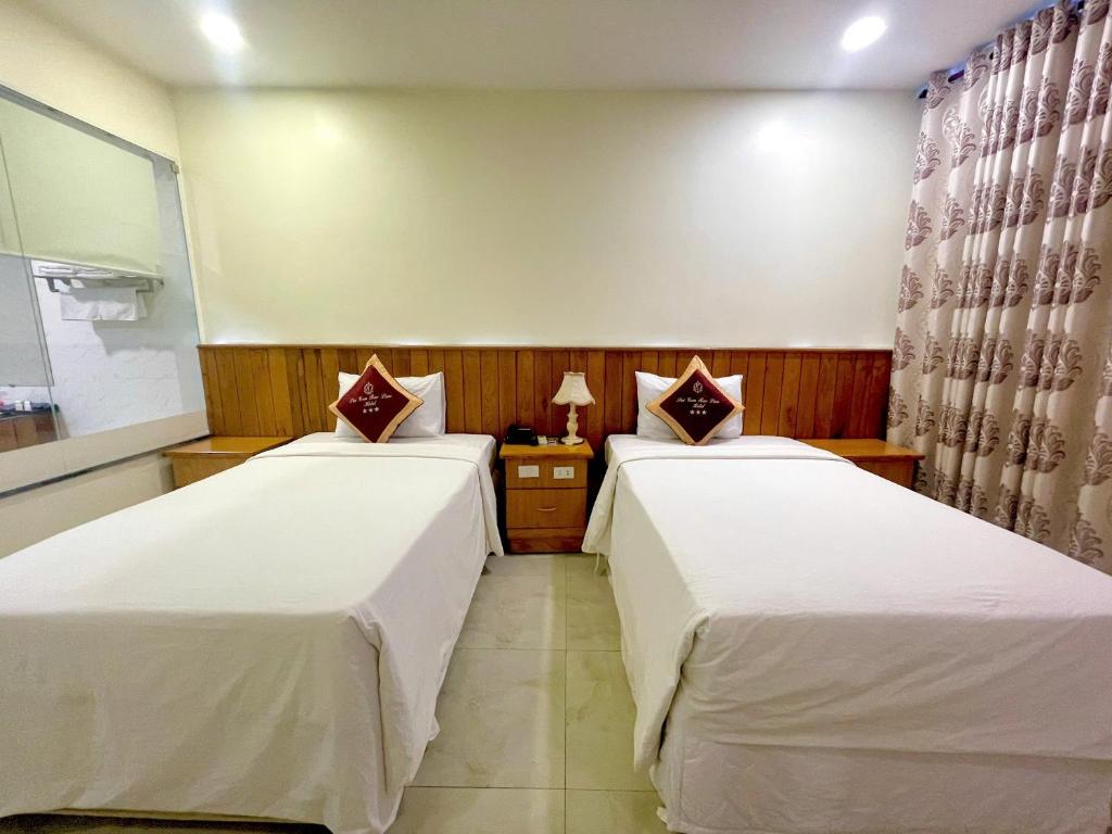 Postel nebo postele na pokoji v ubytování SÀI GÒN - BẠC LIÊU Hotel