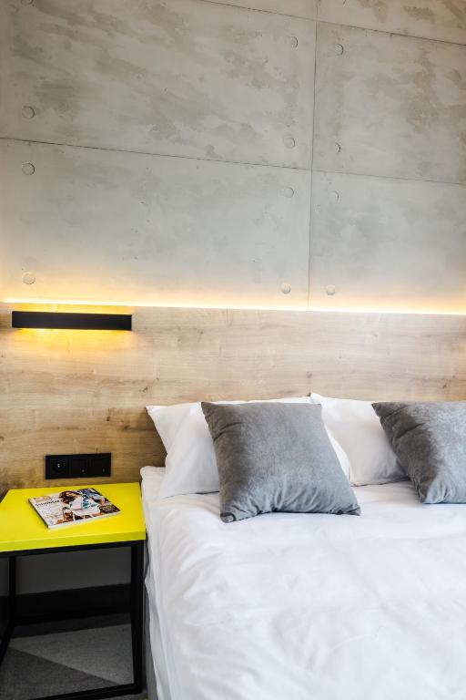 Postel nebo postele na pokoji v ubytování Air Hotel