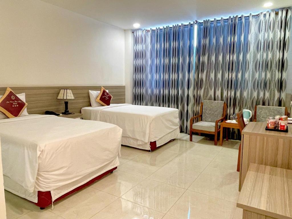 Postel nebo postele na pokoji v ubytování SÀI GÒN - BẠC LIÊU Hotel