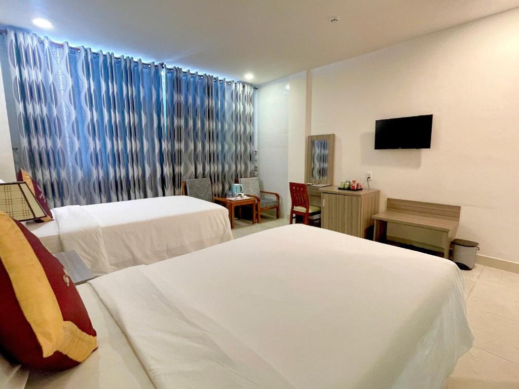 Postel nebo postele na pokoji v ubytování SÀI GÒN - BẠC LIÊU Hotel