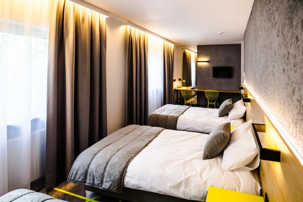 Postel nebo postele na pokoji v ubytování Air Hotel