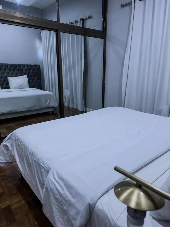 Postel nebo postele na pokoji v ubytování Tsitsi Sea Side