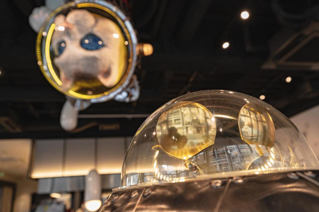 a close up of a glass object with a dog on it at WeBase Hiroshima in Hiroshima