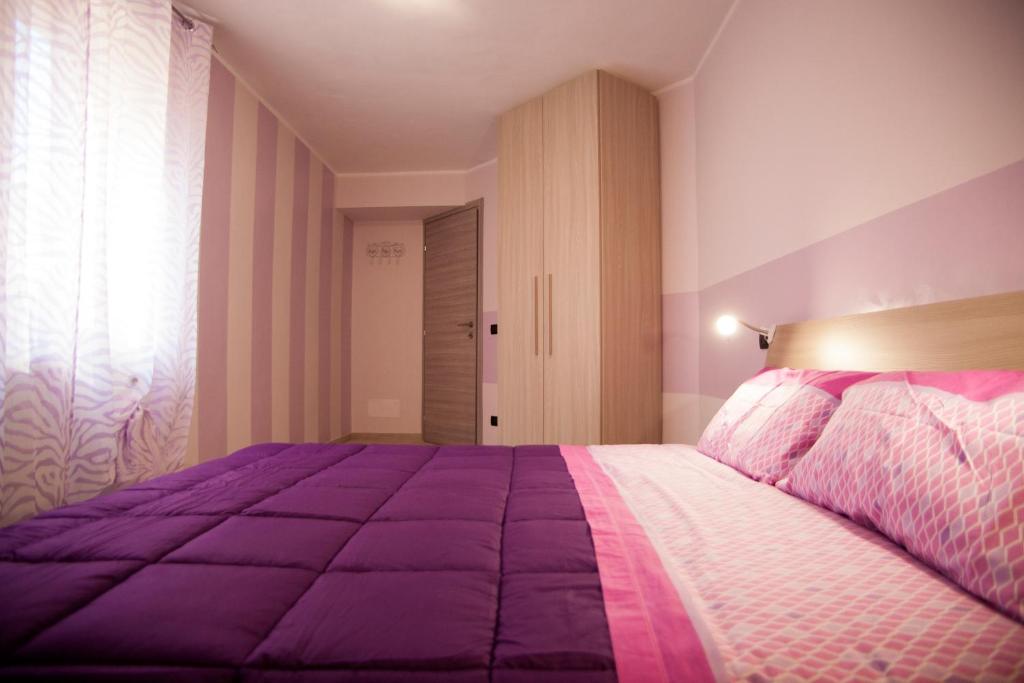 Postel nebo postele na pokoji v ubytování Casa Vacanze Evelina