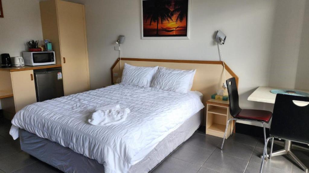 Postel nebo postele na pokoji v ubytování Jopen Motel Unit 5