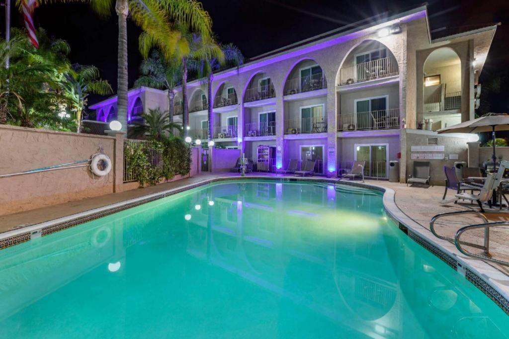 a swimming pool in front of a building at night at Comfort Inn Escondido San Diego North County in Escondido