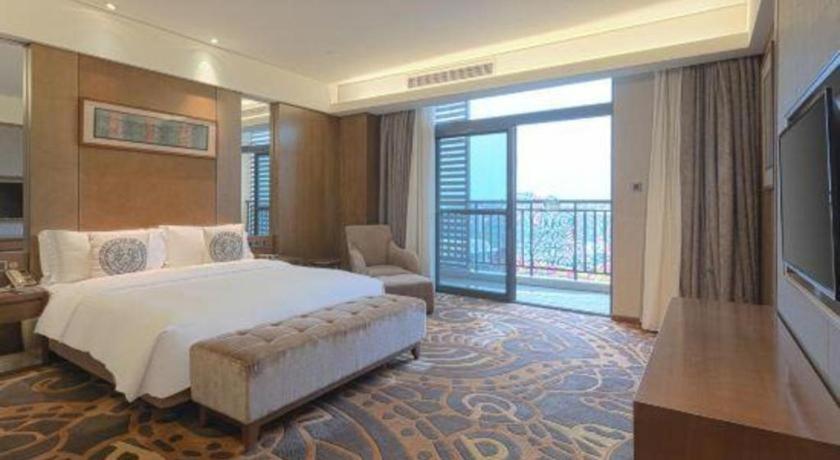 Ένα ή περισσότερα κρεβάτια σε δωμάτιο στο Wuhan Gleetour Hotel