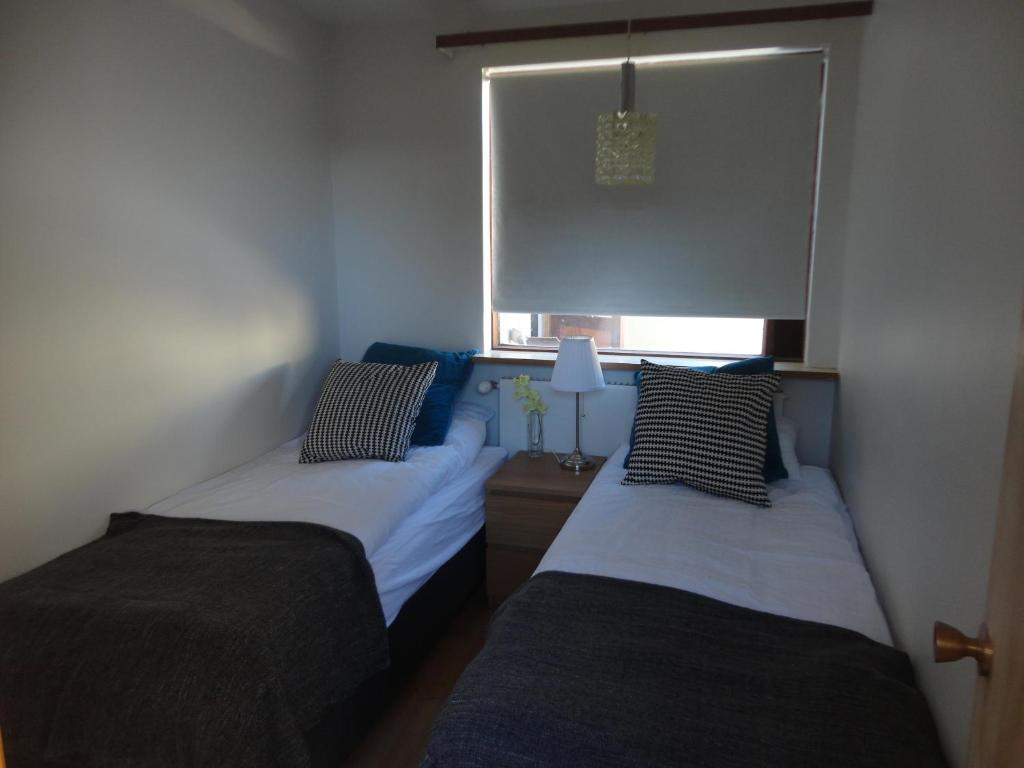 Rúm í herbergi á BSG Apartments