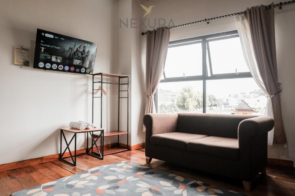 TV a/nebo společenská místnost v ubytování Limaran Syariah Nexura Collection