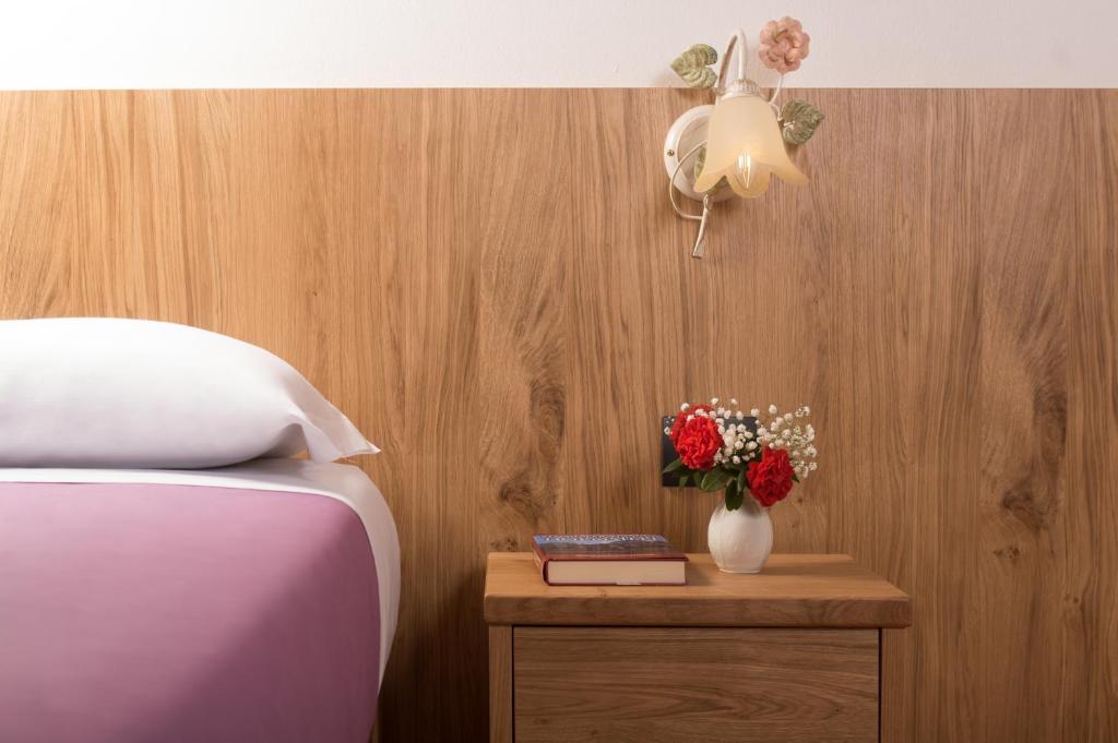 Postel nebo postele na pokoji v ubytování Hotel Centrale