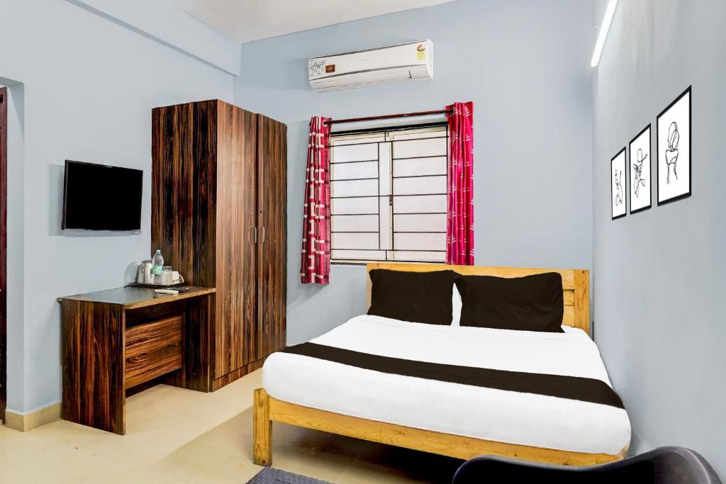 Postel nebo postele na pokoji v ubytování Super Hotel O Kanathur ECR