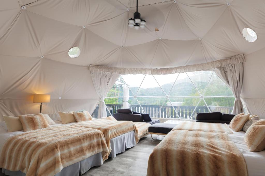 Postel nebo postele na pokoji v ubytování TOCORO. Mt.Fuji CAMP&GLAMPING