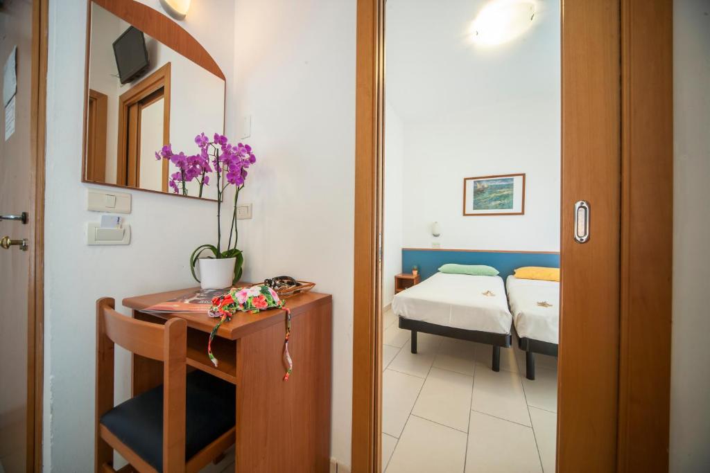 Postel nebo postele na pokoji v ubytování Hotel Taormina