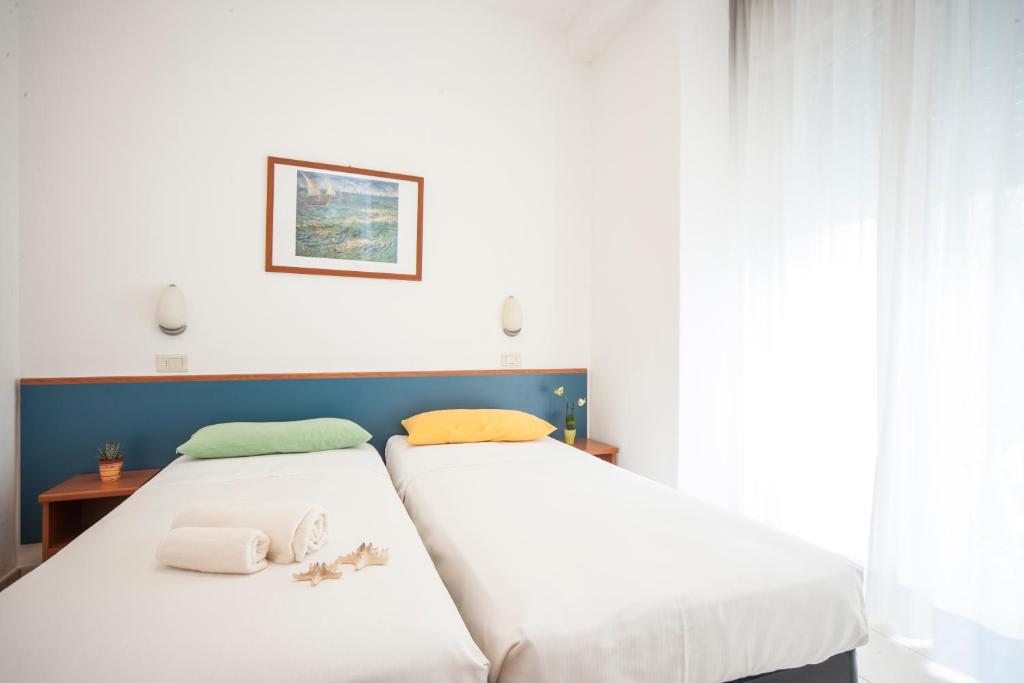 Postel nebo postele na pokoji v ubytování Hotel Taormina