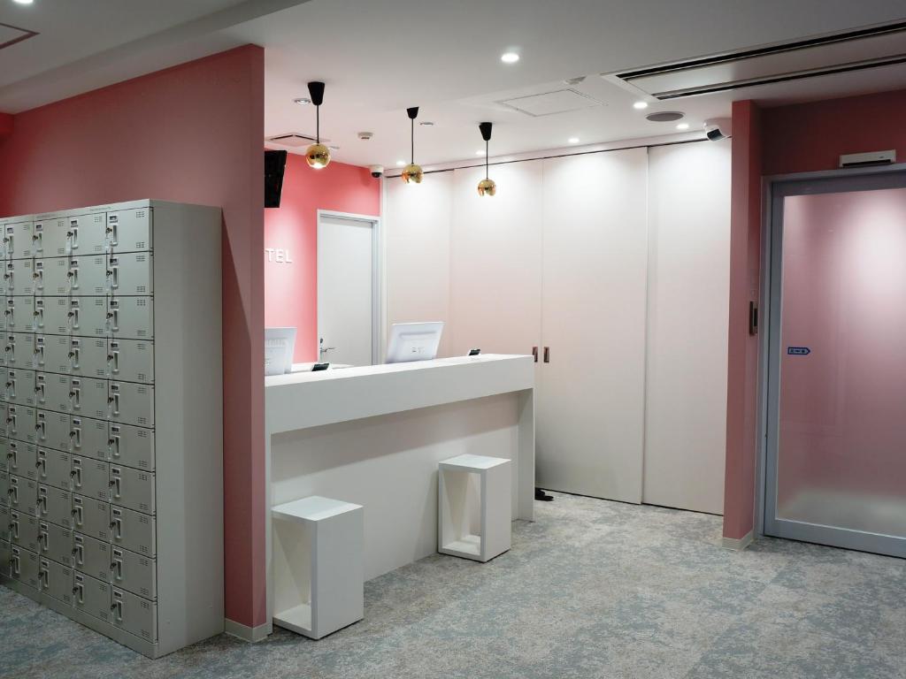 a dressing room with a counter and a mirror at Akihabara Bay Hotel (Female Only) in Tokyo