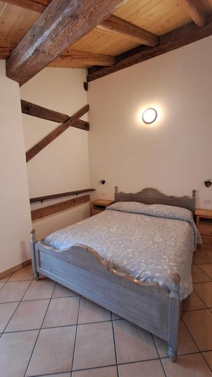 Postel nebo postele na pokoji v ubytování Antico Fienile By Go new Location