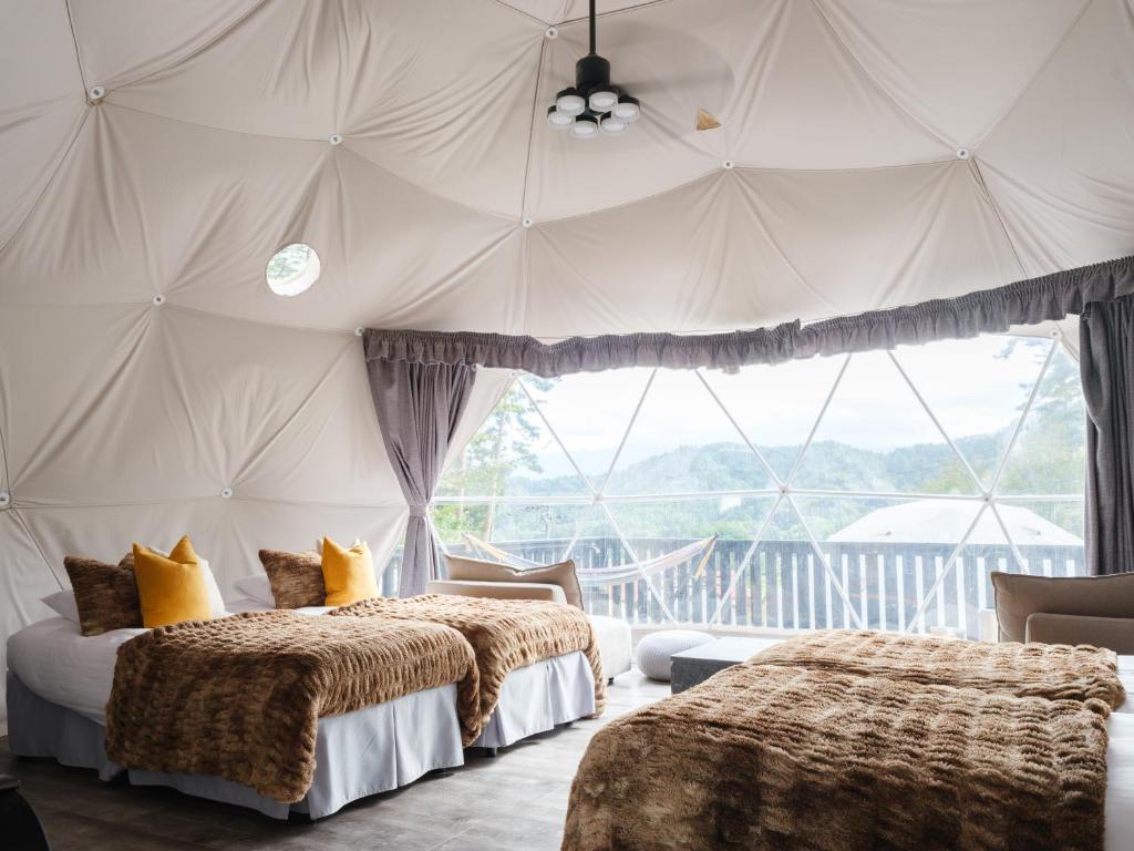 Postel nebo postele na pokoji v ubytování TOCORO. Mt.Fuji CAMP&GLAMPING